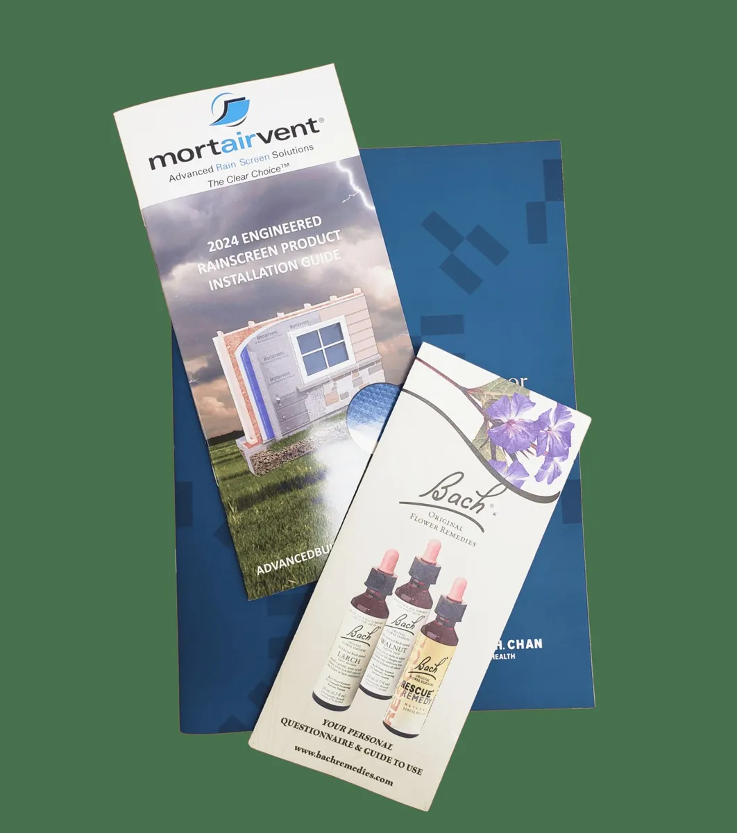 Two folded brochures lying on a blue presentation folder